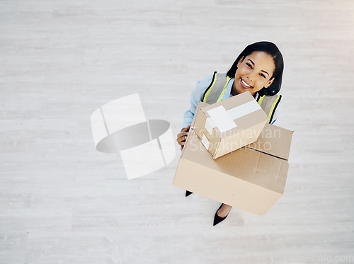 Image of Boxes, portrait and a courier or delivery woman from above for logistics, cargo or shipping industry. Happy female worker with cardboard box or package for supply chain or distribution service mockup