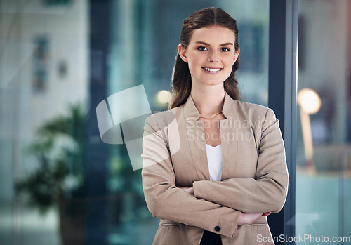 Image of Arms crossed, smile or portrait of businesswoman with confidence, happy face or empowerment. Startup, confident or proud female employee smiling with positive mindset or optimistic attitude in office