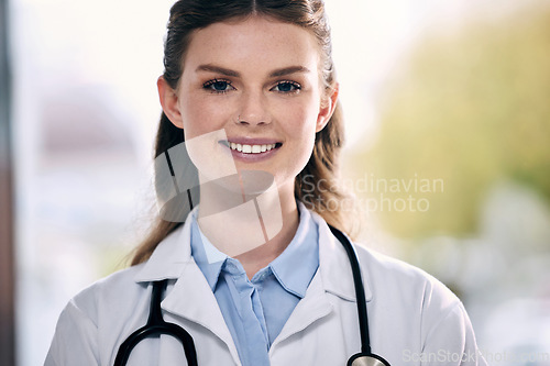 Image of Portrait, happy woman or confident doctor in hospital to help with trust, smile or positive mindset. Face, wellness or friendly medical healthcare professional smiling with nursing success in clinic
