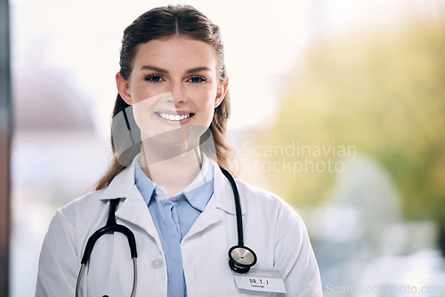 Image of Portrait, happy woman or proud doctor in hospital to help with confidence, smile or positive mindset. Face, mockup or friendly medical healthcare professional smiling with nursing success in clinic