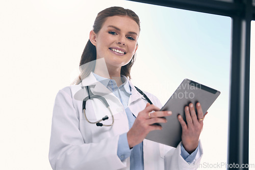 Image of Tablet, happy woman or portrait of doctor in hospital with research to search for medicine on social media. Telehealth, scroll or medical healthcare professional browsing on app to chat in clinic