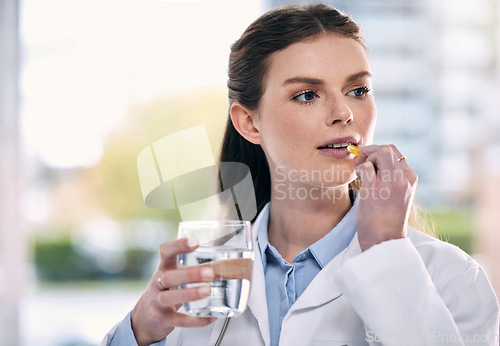 Image of Doctor, drinking water or woman in hospital with pills or supplements for healthcare vitamins or medicine. Stress, medication tablets or sick medical worker taking drugs for depression or headache