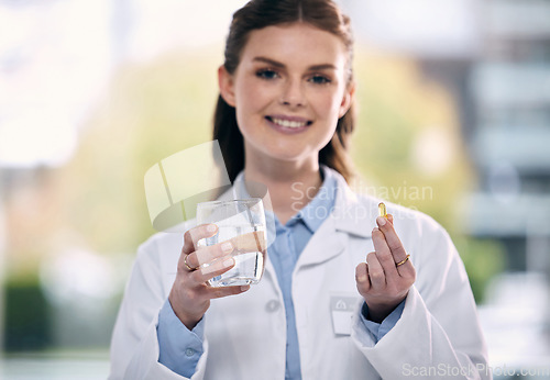 Image of Portrait, water glass or happy doctor in hospital with pills or supplements for healthcare vitamins or medicine. Smile, medication tablets or medical worker giving cure for allergy, anxiety or pain