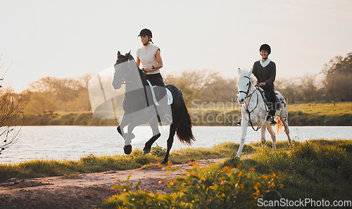 Image of Horse riding, freedom and hobby with friends in nature on horseback by the lake during a summer morning. Countryside, equestrian and female riders outdoor together for travel, fun or adventure