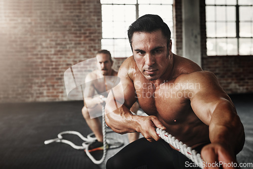 Image of Men, gym and pull rope for exercise with strong muscle, coaching or teamwork for health, self care and together. Body builder partnership, focus and tug of war for workout, health or support on floor