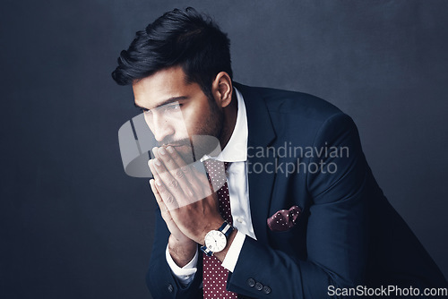 Image of Corporate, thinking and Indian man with stress, worry and employee against a dark studio background. Male person, entrepreneur and agent confused, mistake and anxious with depression, fail or anxiety