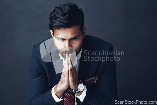 Image of Corporate, thinking and Indian man with stress, confused and employee against a dark studio background. Male person, entrepreneur and agent with worry, anxiety and business owner with contemplation