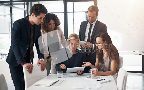 Image of Business people, corporate meeting with tablet and planning ideas in collaboration on project proposal. Teamwork, strategy and b2b workshop, men and women with target management in happy office.