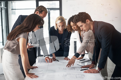 Image of Business people, architect and blueprint in meeting, collaboration and planning for strategy at office. Group of contract engineers in teamwork, floor plan or documents for industrial architecture