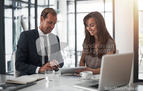 Image of Laptop, collaboration or coaching with a mentor and employee in the boardroom for an introduction to the business. Teamwork, training or partnership with a male manager talking to a woman colleague