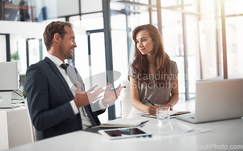 Image of Laptop, collaboration or education with a mentor and employee in the boardroom for an introduction to the business. Teamwork, coaching or partnership with a male manager training a woman colleague