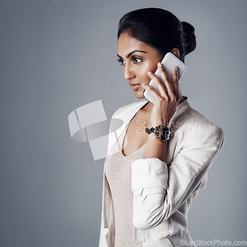 Image of Phone call, business woman and communication or conversation with contact, client or customer in corporate job. Talking, professional crm and Indian model with mobile for b2b, work or discussion