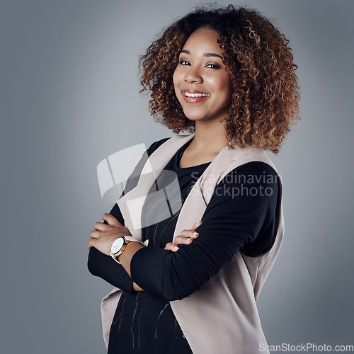 Image of Entrepreneur, arms crossed and portrait of business woman in studio for professional, natural or confidence. Happy, smile and career with face of employee on grey background for manager and pride