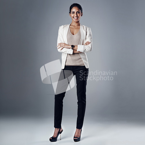 Image of Happy, arms crossed and portrait of business woman in studio for professional, natural or confidence. Smile, corporate and career with female employee on grey background for manager and pride