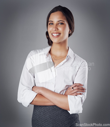 Image of Pride, arms crossed and portrait of business woman in studio for professional, natural or confidence. Happy, corporate and career with face of female employee on grey background for manager and smile