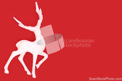 Image of Christmas Eve Reindeer on Red Background