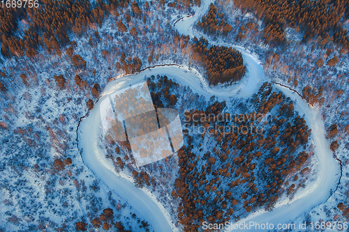 Image of Aerial view of a heart shaped winter forest