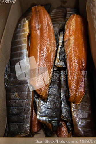 Image of Smoked fish in craft paper box.
