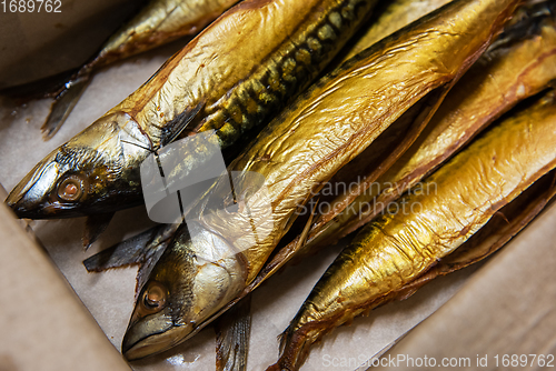 Image of Smoked fish in craft paper box.