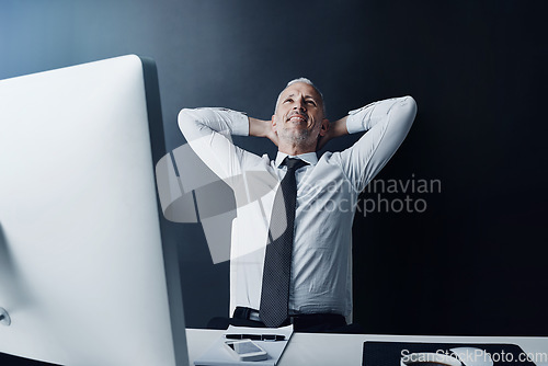 Image of Elderly business man, pride and relax in office for satisfaction, achievement and smile at finance company. Mature ceo, relief or rest at desk with hands behind head, happy or thinking in workplace