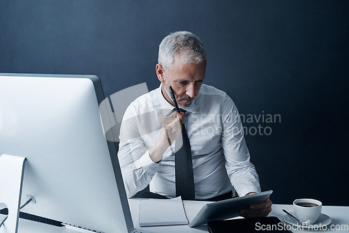 Image of Tablet, idea and business man in office at desk for social media, internet and website research for project. Corporate workplace, thinking and male person on digital tech for writing email and chat