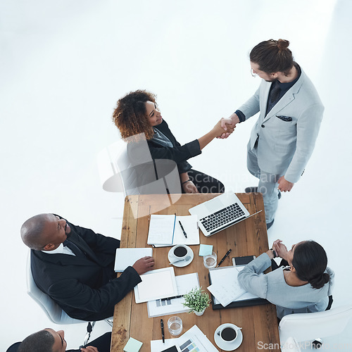 Image of Handshake, meeting and business people in partnership, b2b onboarding and thank you, success or project deal. Professional woman shaking hands with employee for thanks, welcome or collaboration above