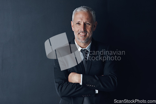 Image of Arms crossed, smile and face of business man in studio for professional, corporate or manager. Boss, pride and confidence with senior male ceo on black background for executive and mockup space