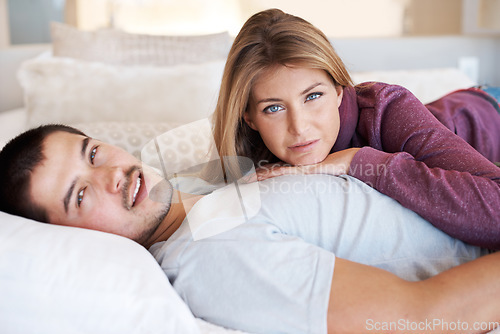 Image of Love, marriage and portrait of couple on bed to relax, bonding and spending quality time together in home. Relationship, man and woman in bedroom with romance, embrace and care in apartment in USA.