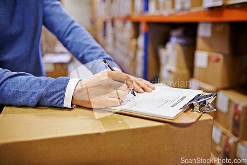 Image of Hands, sign and clipboard with factory with boxes, clipboard and supply chain warehouse. Delivery, ecommerce and person signature on distribution paperwork, shipping parcel or package with logistics