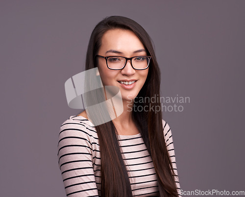 Image of Portrait, fashion glasses and happy woman in studio isolated on a gray background mockup space. Face, nerd and female geek, person or model from Canada with trendy clothes, eyewear and casual style.