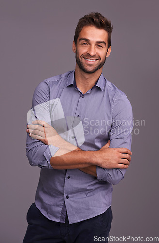 Image of Portrait, auditor and business man with arms crossed in studio isolated on a gray background. Confident, happy and person, professional or accountant from Canada with trendy clothes, fashion or style