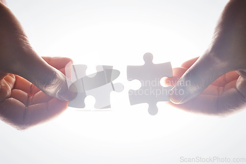 Image of Puzzle, people hands and teamwork, integration or problem solving, collaboration and solution isolated on white background. Coworking, synergy and person or partner team building, support and below