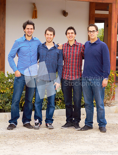 Image of Group, causal and portrait of male friends together standing in an outdoor garden by their house. People, smile and full body of happy men in casual outfit standing with embrace in backyard or nature