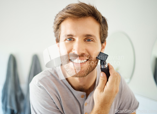 Image of Portrait, man and shave beard with razor for hair removal, aesthetic skincare and facial beauty cleaning in morning at home. Happy guy shaving face with blade, trimmer and cosmetic tools in bathroom