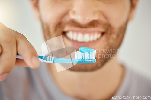 Image of Brushing teeth, toothbrush and closeup with man in bathroom for self care, oral hygiene and dental. Cleaning, smile and health with male person at home for beauty, wellness and morning routine