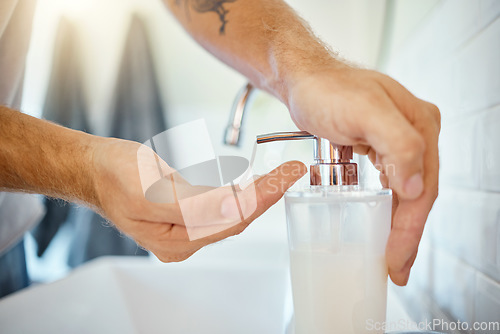 Image of Bottle, soap or hands of man at tap for cleaning, washing or safety of virus, bacteria or germs in bathroom. Closeup, hand and liquid gel dispenser for hygiene, wellness and healthy habit of skincare