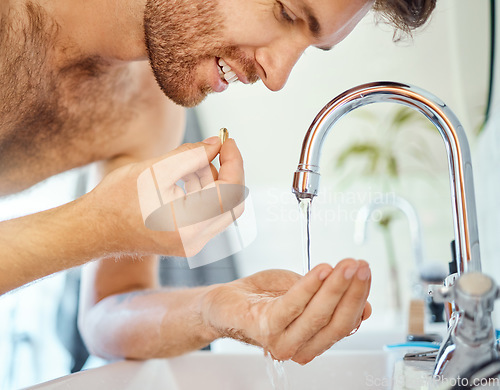 Image of Bathroom, tap water and man with pills, tablet or morning supplements for healthcare, wellness or medication. Liquid drink, sink and home person eating vitamin for health balance, energy or nutrition