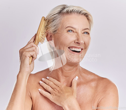 Image of Senior woman, hair and brush with beauty and smile, styling locks and cosmetics on white background. Skin, antiaging and salon treatment with routine, female model and haircare tools with hairstyle