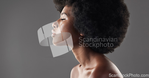 Image of Hair care, mockup and profile of black woman with afro hairstyle, beauty and skincare on grey background. Natural haircare, cosmetics and face of African model with skin glow or shine in studio space