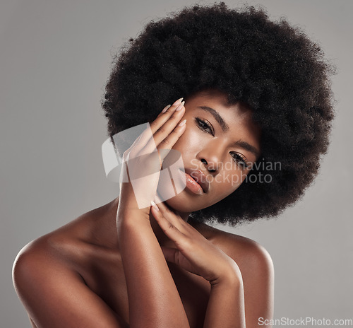 Image of Black woman, portrait and hands touching face, natural beauty and afro hair with glow on studio background. African female model, cosmetic care and healthy skin, facial and shine with skincare