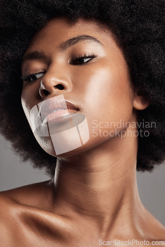 Image of Face, black woman and natural beauty in studio, background or dermatology. African female model thinking of aesthetic shine, skincare treatment and facial glow for afro hair, self care or cosmetology