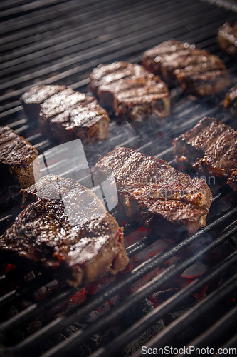 Image of Steaks are generously covered in seasoning