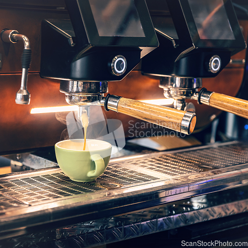 Image of Cappuccino flowing into a coffee cup