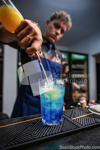 Image of Professional bartender making cocktail