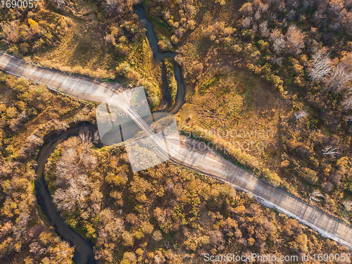 Image of Autumn landscape with river and bridge