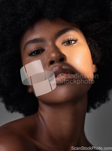 Image of Dark portrait light, makeup or black woman with beauty foundation, natural facial cosmetics and spa skincare shine. Studio lighting, face shadow or African person with glowing skin on grey background