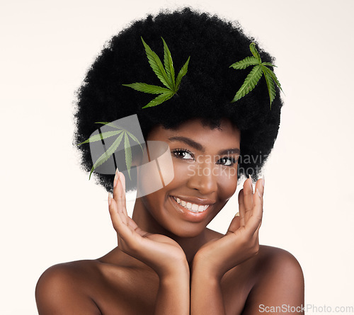 Image of Black woman, leaves and marijuana in studio portrait, pride and organic skincare by white background. African girl, model or hemp for beauty, makeup or glow on skin for aesthetic, afro and cosmetics