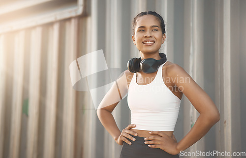 Image of Fitness, woman with headphones and training with lens flare happy. Exercise or workout, motivation or healthy lifestyle and African female athlete pose in sportswear for health wellness