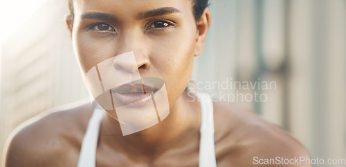 Image of Face, portrait of a woman and fitness with a lens flare outdoors. Exercise or training, workout or motivation and closeup with African female athlete pose for health wellness or breathing