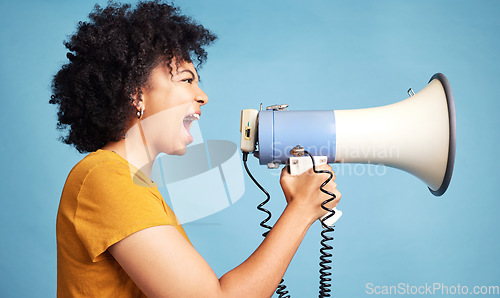 Image of Megaphone, voice and young woman for human rights, racism and equality, freedom of speech, strong opinion or fight, African person protest, call to action or change and justice on a blue background